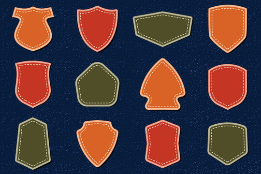 Shield embroidery patches on denim background vector collection with stitched badge shapes textile mockup for fashion apparel design isolated on dark fabric texture