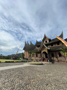 Iconic Rumah Gadang traditional Minangkabau architecture under dramatic sky in Indonesia