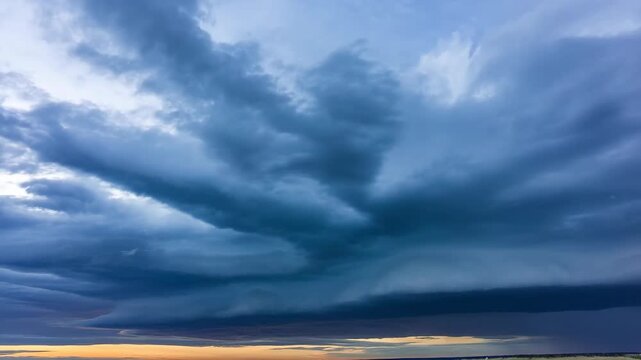 Clouds dramatic stormy sky with rain shafts over land horizon at sunset, nature photography featuring storm, weather, thunderclouds with dark and