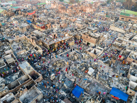 Aerial view of a landscape scarred by fire, with remnants of homes amidst a sea of ash and debris, Dhaka, Dhaka Division, Bangladesh.