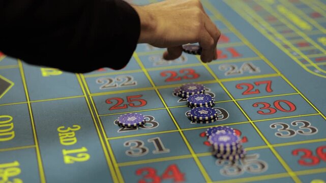 Casino Dealer Dealing Cards at Poker Table with Chips