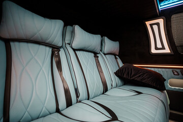 Fototapeta premium Luxury Light Blue Leather Passenger Seats in High End Private Van or Executive Transport Vehicle