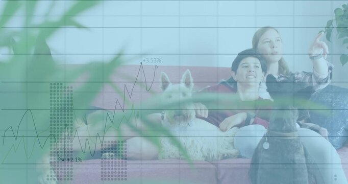 Animation of statistical data processing over caucasian lesbian couple watching tv together at home