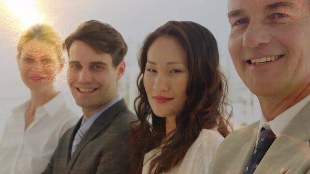Animation of aerial view of city on coast over multiracial coworkers standing in row at office
