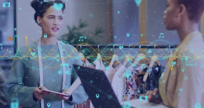 Animation of graphs and connected icons over diverse female designers discussing about fashion