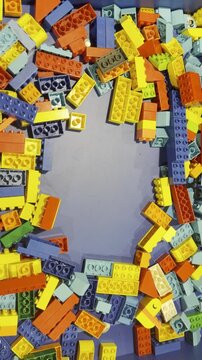 Colorful building blocks scattered around empty center