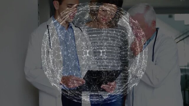 Holo orb appearing then fading over tablet patient junior Dr tapping senior Dr thinking case review