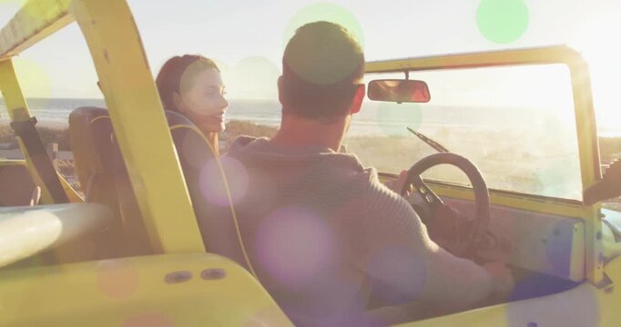 Spotting surf, woman in red leaning, reaching surfboard on yellow buggy, hoodie driver listening