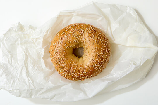 Overhead view of bagel on white background