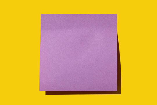 Blank purple post it note on yellow background