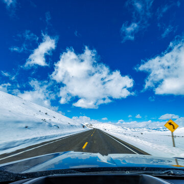 Empty Idaho Highway 20 in winter seen from car