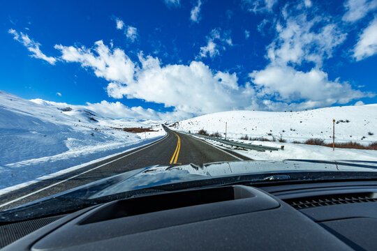 Empty Idaho Highway 20 in winter seen from car