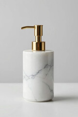 Obraz premium white marble soap dispenser with gold pump high end product shot