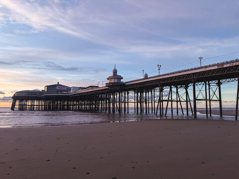 Sunset of the beautiful beach and pier at Blackpool, UK.