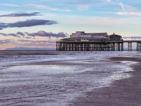 Sunset of the beautiful beach and pier at Blackpool, UK.