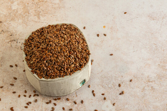 Whole flaxseed in a ceramic bowl 