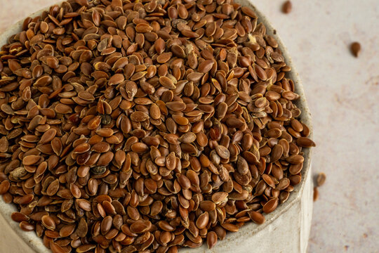 Whole flaxseed in a ceramic bowl 