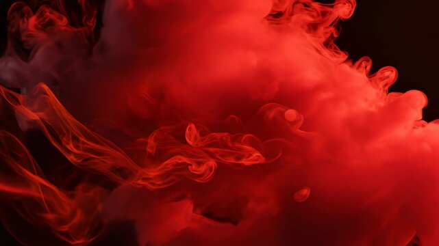 Red smoke cloud on black background for commercial backgrounds, digital design, and advertising