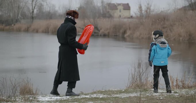 Man and kid boy go for walk. Dad and son play outside. 4K 10-bit