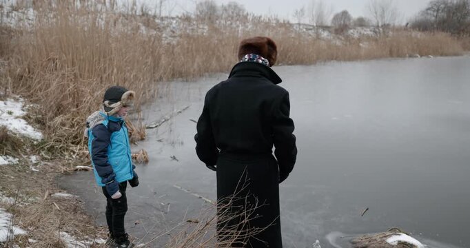 Man and kid boy go for walk. Dad and son play outside. 4K 10-bit