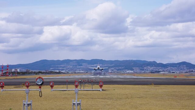 Atami Airport, Slow Motion Establishing Shot as Plane Lands, Osaka Japan