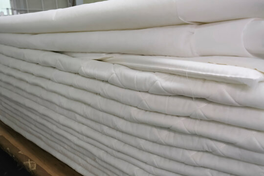 Sewing mattress on special machines at garment factory, the outer soft part of the mattress
