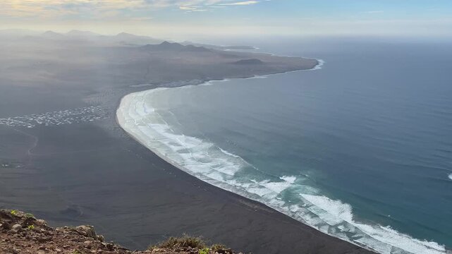 View from Mirador Rinc&oacute;n de Har&iacute;a on famous surf Famara beach, Lanzarote, Har&iacute;a, Canary Islands, Spain