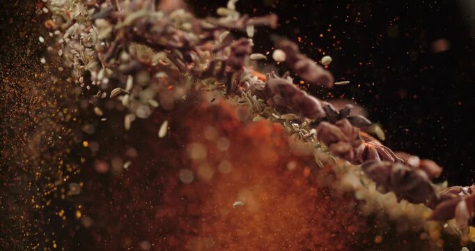 Spices Floating in Slow Motion Macro Close Up with Cloves, Cardamom, Cumin, chilli powder