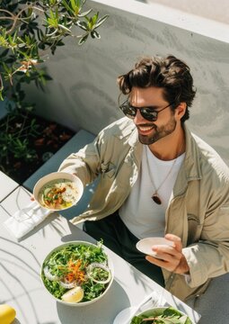 A happy man eating lunch table face accessories.