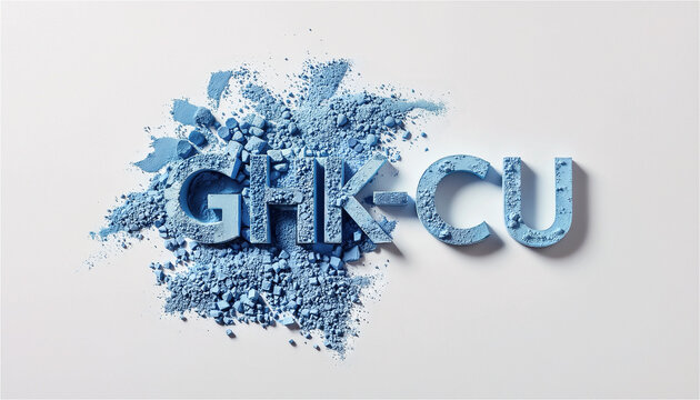 GHK-CU letters carved in blue cosmetic powder on white background. Peptide skin care concept for anti-aging serum and collagen beauty product advertisement. Minimalist top view