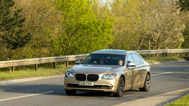 Milton Keynes,Bucks,UK - Apr 8th  2026:  2011 BMW 730 diesel engine car driving. on a British road