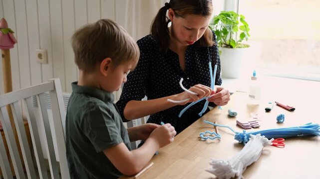 Happy Children Laugh and Fun Make DIY Toys. Kids Crafting from Fluffy wire, Bending Plush. Craft Pipe Cleaners. Leisure on Holidays. Thick Fluffy Chenille Stems for Arts. Supplies, Chenille Stems.