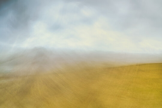 Misty twilight hues paint the desolate landscape with muted tones.