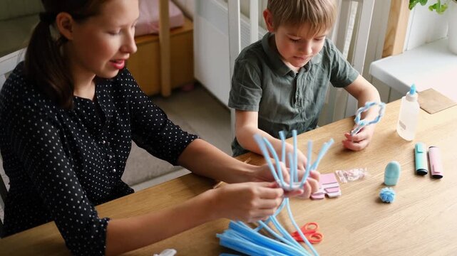 Happy Children Laugh and Fun Make DIY Toys. Kids Crafting from Fluffy wire, Bending Plush. Craft Pipe Cleaners. Leisure on Holidays. Thick Fluffy Chenille Stems for Arts. Supplies, Chenille Stems.