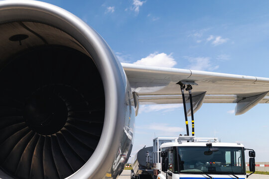 Refueling of airplane at airport. Ground service before flight.