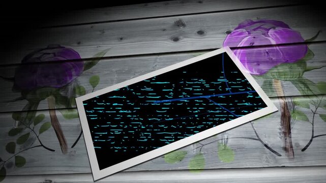 Animation of tablet and flowers on wooden background
