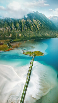 Lofoten islands aerial view travel in Norway turquoise sea with coastal road and mountains in summer season, Scandinavian nature must see travel destinations epic scenery