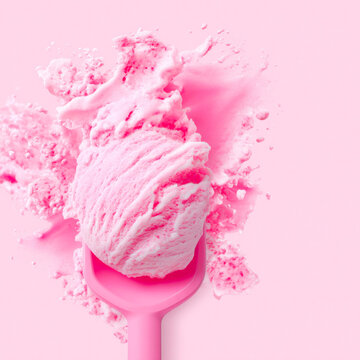 Fresh Pink Strawberry Ice Cream Scoop On Spoon With Artistic Milk Powder Splash Background