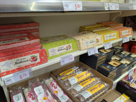 Marratx&iacute;, Mallorca, Spain &ndash; April 07, 2026: Traditional artisan Spanish turr&oacute;n nougat bars, Vicens and Mallorca S.L sweets and premium assorted confectionery products display at Alcampo supermarket.