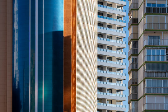Facade textures in spain create a modern pattern as urban architecture of vertical buildings and apartments forms a layered graphic surface