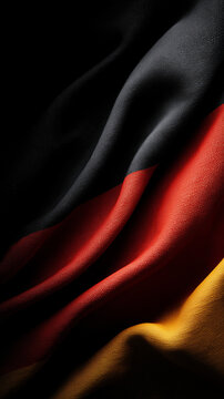 german flag waving in the wind on dark background germany deutschland