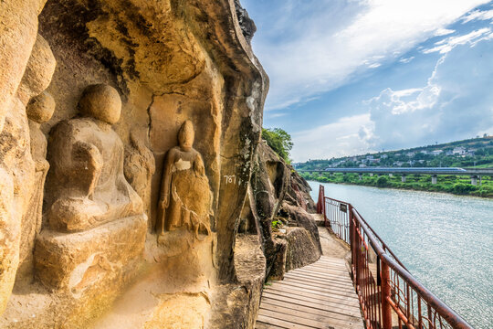 Ancient Buddhist Statues at Qianfoya Cliff with High Speed Train in Guangyuan, Sichuan, China
