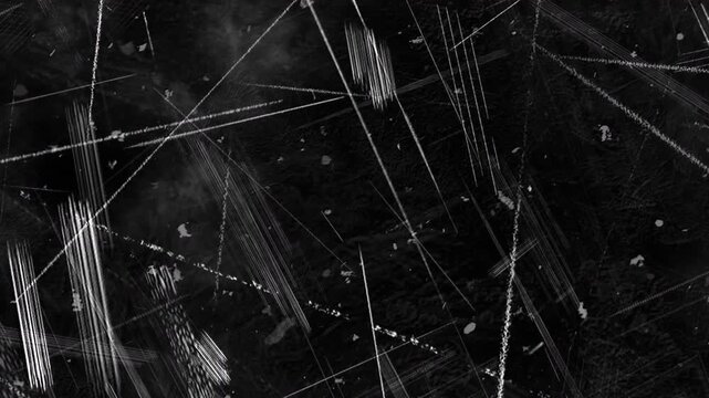 4K Cinematic dark grunge texture overlay featuring intense intersecting white scratches, heavy gouge marks, and scattered dust on a black background for VFX compositing.