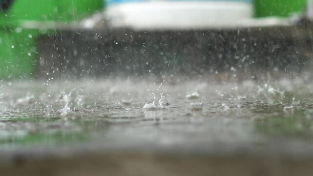 Rain Drops Splashing on Water Surface Monsoon Background Closeup. Monsoon Rain in Kerala South India Water Splash Background. Heavy Monsoon Rainfall in Kerala Tropical South India Scene.