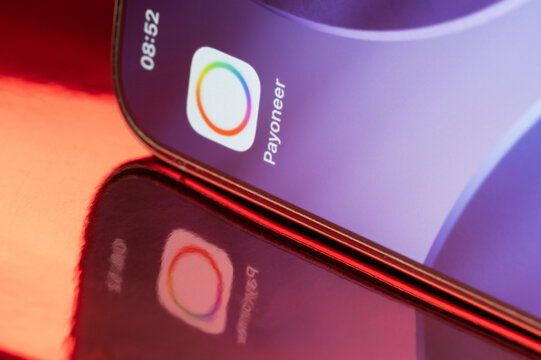 Payoneer icon application on smartphone screen close up