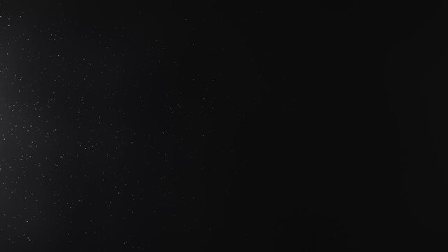 White particles on black background