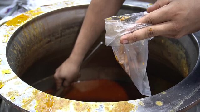 Nihari broth being served from rustic pot, rich and steaming street food, traditional cuisine concept
