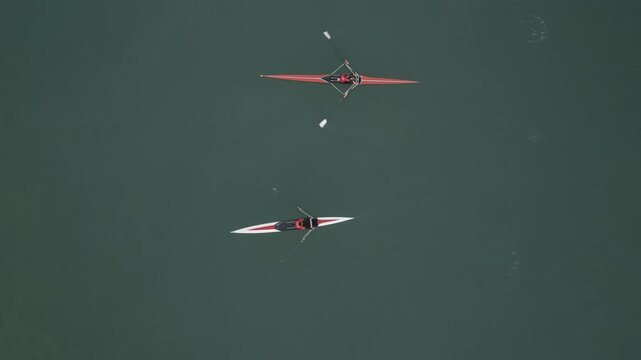 Aerial View Rowers Racing On Water, Calm Green Lake With Two Single Sculls Gliding Sidebyside, Synchronized