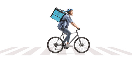 Fototapeta premium Delivery man riding a bicycle on a pedestrian crossing