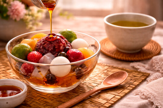 Traditional Japanese Anmitsu Dessert with Kuromitsu Syrup and Green Tea